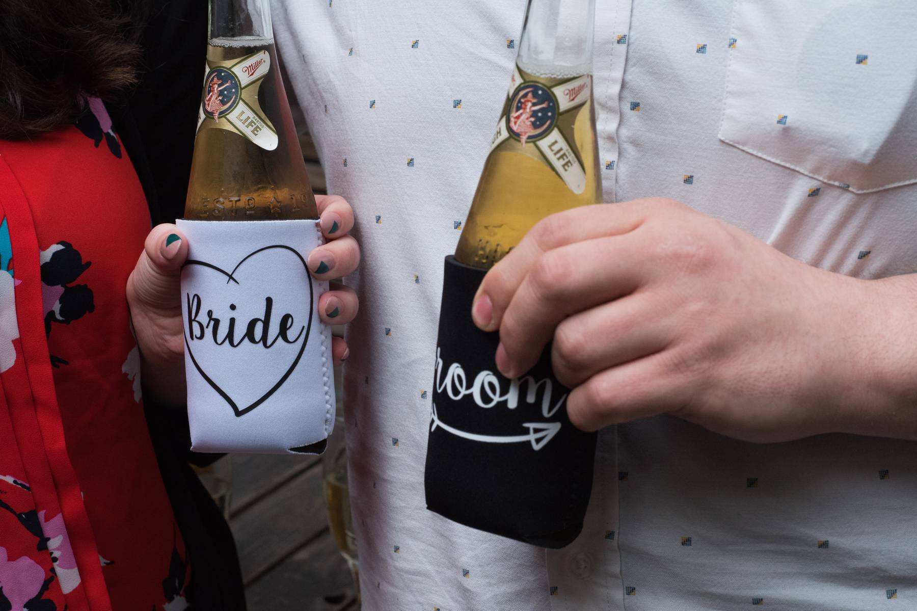 Josh &amp; Michele hold Bride &amp; Groom koozies